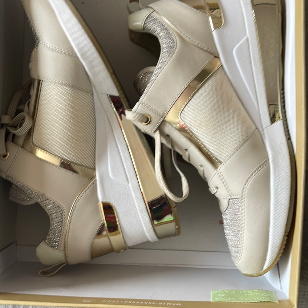 Michael Kor cream and gold shoes.